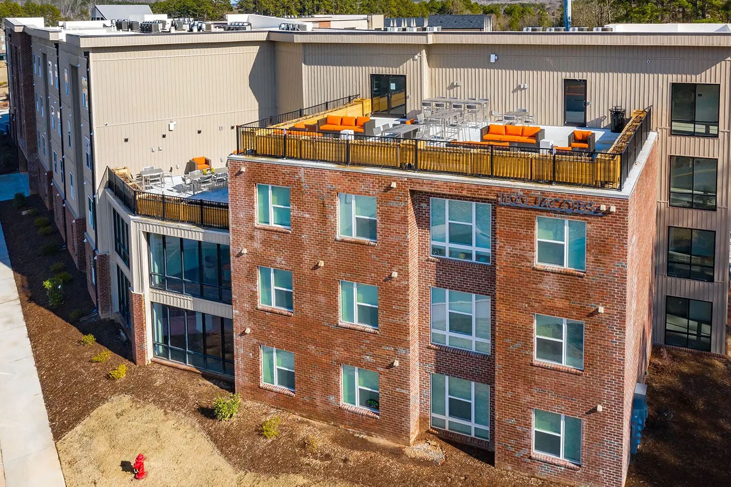 Rooftop seating area on top of apartment complex.